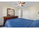 Bedroom featuring dresser with mirror, closet, and window at 5997 S Yakima St, Aurora, CO 80015