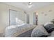 Bedroom featuring a double closet and an ensuite bathroom at 5997 S Yakima St, Aurora, CO 80015