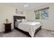 Bedroom with large window, ceiling fan, and neutral decor at 5997 S Yakima St, Aurora, CO 80015
