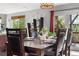 Dining room featuring hardwood floors, a modern chandelier, and french doors at 5997 S Yakima St, Aurora, CO 80015