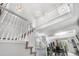 Bright foyer with high ceilings, white railing staircase and chandelier at 5997 S Yakima St, Aurora, CO 80015