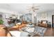 Bright living room featuring hardwood floors, neutral paint, and open floor plan at 5997 S Yakima St, Aurora, CO 80015