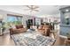 Spacious living room featuring hardwood floors, large windows, and neutral paint at 5997 S Yakima St, Aurora, CO 80015