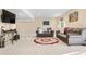 Spacious living area with two couches, carpeted floors, and a decorative rug at 5997 S Yakima St, Aurora, CO 80015