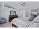 Main bedroom featuring neutral paint, carpet, and ensuite bathroom at 5997 S Yakima St, Aurora, CO 80015