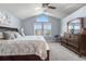 Bright main bedroom featuring vaulted ceilings, large windows, and neutral paint at 5997 S Yakima St, Aurora, CO 80015
