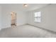 Spacious carpeted bedroom with neutral walls and trim plus attached bathroom at 39460 Congress Ln, Elizabeth, CO 80107