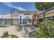 Commercial building with outdoor seating and multiple businesses at 39460 Congress Ln, Elizabeth, CO 80107