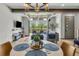 Contemporary dining area with stylish lighting and patio views at 4021 S Teller St, Lakewood, CO 80235