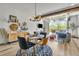 Elegant dining room with modern furnishings and seamless access to the outdoors at 4021 S Teller St, Lakewood, CO 80235