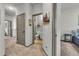 Hallway leading to a well-lit bathroom and bedroom at 4021 S Teller St, Lakewood, CO 80235