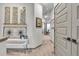 Hallway featuring modern art, leading to a room with natural light at 4021 S Teller St, Lakewood, CO 80235