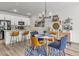 Well-appointed kitchen with modern appliances and a breakfast bar at 4021 S Teller St, Lakewood, CO 80235