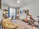 Bright home office space with a large window, desk, and exercise equipment at 4021 S Teller St, Lakewood, CO 80235