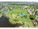 Aerial shot of a park including tennis courts, playground, walking paths, and a pond at 7422 S Quail Cir # 1624, Littleton, CO 80127