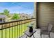 Relaxing balcony with furniture, string lights, and a view of the green lawn at 7422 S Quail Cir # 1624, Littleton, CO 80127