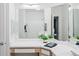 Bright bathroom featuring vanity, mirrors and white shower curtain at 7422 S Quail Cir # 1624, Littleton, CO 80127
