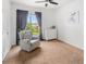 Cozy bedroom with a chair by the window, a dresser, and soft carpet at 7422 S Quail Cir # 1624, Littleton, CO 80127