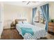 Comfortable bedroom with ceiling fan, curtains and a bright window at 7422 S Quail Cir # 1624, Littleton, CO 80127
