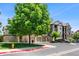 Well-maintained condo community with mature tree, garages, sidewalks, and visible fire hydrant at 7422 S Quail Cir # 1624, Littleton, CO 80127