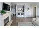 Cozy living room with fireplace, TV, breakfast bar and dining area at 7422 S Quail Cir # 1624, Littleton, CO 80127