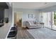 Comfortable living room featuring a sofa and balcony with a view at 7422 S Quail Cir # 1624, Littleton, CO 80127