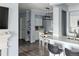 Open-concept living area featuring white countertops, modern appliances, and a dining table at 7422 S Quail Cir # 1624, Littleton, CO 80127