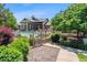 Community pool area featuring a spacious deck, comfortable lounge chairs, and lush landscaping at 7422 S Quail Cir # 1624, Littleton, CO 80127