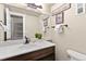 Tastefully decorated half bathroom with stylish mirror and fixtures at 200 Primrose Path # 11, Breckenridge, CO 80424