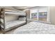 Cozy bedroom with bunk beds and bright window at 200 Primrose Path # 11, Breckenridge, CO 80424