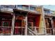 Charming multi-level home featuring wood siding, red door, exterior stairs, and upper-level balconies at 200 Primrose Path # 11, Breckenridge, CO 80424