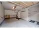 Clean, well-lit garage featuring epoxy flooring, built-in shelving, and ample space for parking and storage at 200 Primrose Path # 11, Breckenridge, CO 80424