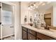 Bathroom with double sink vanity, neutral walls, and large mirror at 42704 Calusa Pines Rd, Elizabeth, CO 80107