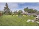 Lush backyard with a charming garden, a privacy fence, and mature trees at 5925 W 86Th Ave, Arvada, CO 80003