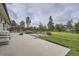 Expansive backyard featuring a concrete patio, lush lawn, and a wood fence at 5925 W 86Th Ave, Arvada, CO 80003