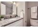 This bathroom features granite countertops, a modern sink, and ample lighting, all while being efficient in design at 5925 W 86Th Ave, Arvada, CO 80003