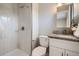 The bathroom has tile flooring, modern fixtures, and a sleek shower; offering a clean design at 5925 W 86Th Ave, Arvada, CO 80003