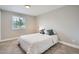 Cozy bedroom with plush carpeting, a comfortable bed, and a window offering natural light at 5925 W 86Th Ave, Arvada, CO 80003