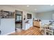 Open dining area with wooden floors and access to a view of the living room at 5925 W 86Th Ave, Arvada, CO 80003