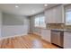 Bright kitchen featuring stainless steel appliances, granite countertops, and hardwood floors at 5925 W 86Th Ave, Arvada, CO 80003