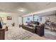 Spacious basement living area features carpeted flooring, a comfortable sofa, and room for entertainment at 5925 W 86Th Ave, Arvada, CO 80003
