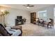 Cozy living room with plush carpeting, ceiling fan, and a decorative fireplace at 5925 W 86Th Ave, Arvada, CO 80003