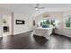 Bright bedroom with ceiling fan, hardwood floors and mountain view at 5980 Dunraven Ct, Golden, CO 80403