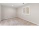 Simple bedroom with neutral carpeting and shuttered window at 5980 Dunraven Ct, Golden, CO 80403