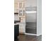 Kitchen features stainless steel refrigerator and granite countertops at 5980 Dunraven Ct, Golden, CO 80403
