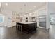 Spacious kitchen featuring a large center island, stainless steel appliances, and custom cabinetry at 5980 Dunraven Ct, Golden, CO 80403