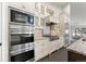 Gourmet kitchen features stainless steel appliances including a double oven and gas cooktop at 5980 Dunraven Ct, Golden, CO 80403