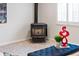 Cozy living area featuring a wood-burning stove, a comfortable bench, and modern decor at 5980 Dunraven Ct, Golden, CO 80403