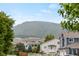 Neighborhood street with lush green trees and mountain views at 5980 Dunraven Ct, Golden, CO 80403
