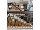 Staircase looking into kitchen with white cabinets and granite countertops at 5980 Dunraven Ct, Golden, CO 80403